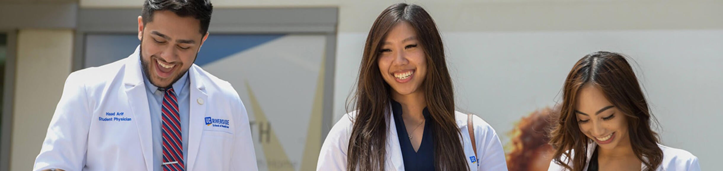 students smiling and walking