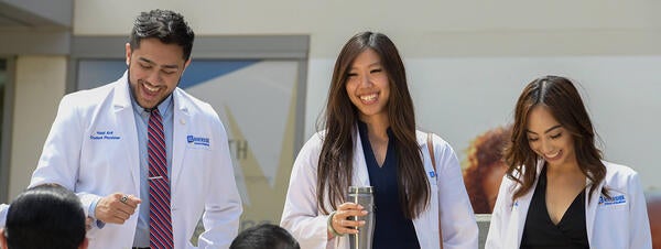students smiling and walking