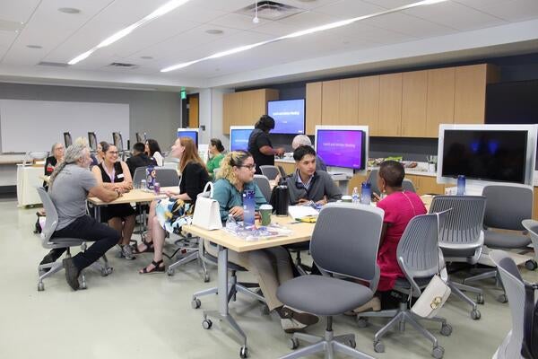 students meeting with the instructors